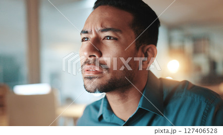 Confused, face and reading with business man in office at night for development, planning or research. Information, thinking and squint with employee at work on computer for evening problem solving Confused, face and reading with business man in office at night for development, planning or research. Information, thinking and squint with employee at work on computer for evening problem solving 127406528