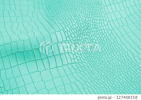 Turquoise color artificial crocodile leather texture background. 127406558