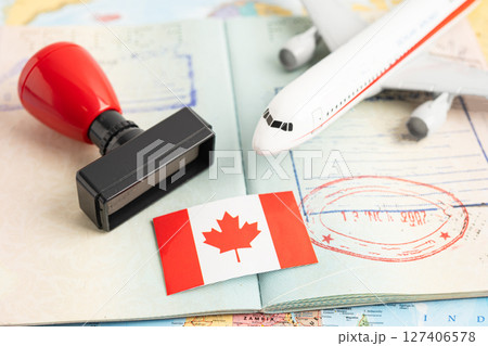 Approved Stamp visa and passport with Korea flag document to immigration at airport in country. Approved Stamp visa and passport with Korea flag document to immigration at airport in country. 127406578