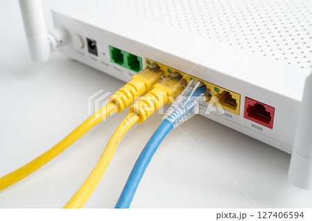 Ethernet cable with wireless router connect to internet service provider internet network. Ethernet cable with wireless router connect to internet service provider internet network. 127406594