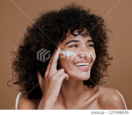 Black woman, facial cream and skincare wellness of happy face skin glow and sunscreen. Cosmetic, collagen and dermatology lotion of a woman model with a smile from natural cosmetics treatment 127406639