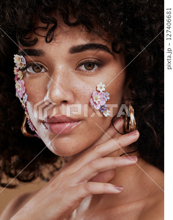 Woman, beauty and face in fine art makeup, cosmetics or facial flower decor for profile or skincare design. Portrait of creative female model posing with beautiful floral cosmetic art deco treatment 127406681