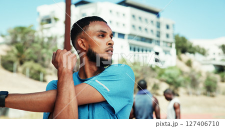 Stretching, runner and thinking with man in stadium for marathon training, health and cardio challenge. Warm up, competition and exercise with person outdoor for athlete, workout and reflection 127406710