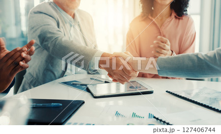 Shaking hands, thank you and business people in office for meeting with finance deal or partnership. Agreement, applause and financial advisors with handshake for congratulations on investment goal. Shaking hands, thank you and business people in office for meeting with finance deal or partnership. Agreement, applause and financial advisors with handshake for congratulations on investment goal. 127406744