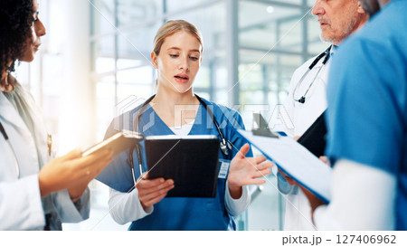Discussion, medical or tablet with doctors and nurses in hospital together for meeting or report. Healthcare, insurance and teamwork with professional medicine team in clinic for diagnosis review 127406962