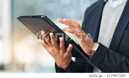 Hands, person and typing on tablet in office for research, financial report and schedule update. Accountant, reading and digital for finance agenda, information and budget review for investment email 127407265