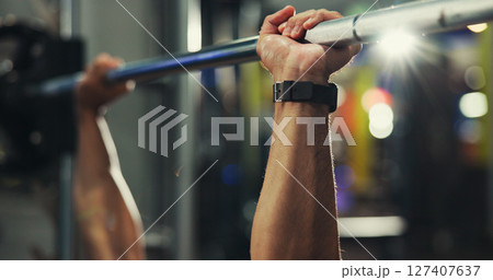 Hands, fitness and man in gym, barbell and training with weightlifting, workout and exercise. Closeup, healthy person and bodybuilder in wellness center, equipment and challenge with power and strong 127407637