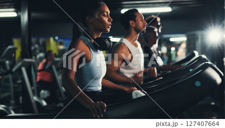 Runner, gym and tired with woman on treadmill for training, breathing and cardio performance. Wellness, fitness and workout challenge with person on running machine for sports, athlete and fatigue Runner, gym and tired with woman on treadmill for training, breathing and cardio performance. Wellness, fitness and workout challenge with person on running machine for sports, athlete and fatigue 127407664