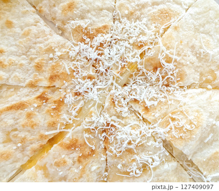 Close up of Roti Cheese, beautiful yellow color, delicious smell, topped with cheese. Close up of Roti Cheese, beautiful yellow color, delicious smell, topped with cheese. 127409097