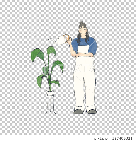 A woman in overalls watering a houseplant 127409321
