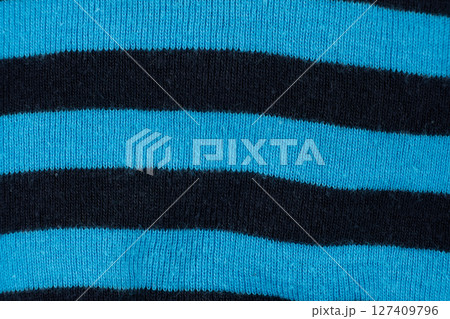 Macro Texture Warm Cotton Striped Black And Blue Fabric Top View. Macro Texture Warm Cotton Striped Black And Blue Fabric Top View. 127409796