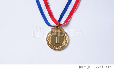 Gold silver and bronze demonstration trophy medals with ribbon for school university or national or olympic sport even organization competition. Isolated on white background. Award and victory concept Gold silver and bronze demonstration trophy medals with ribbon for school university or national or olympic sport even organization competition. Isolated on white background. Award and victory concept 127410347