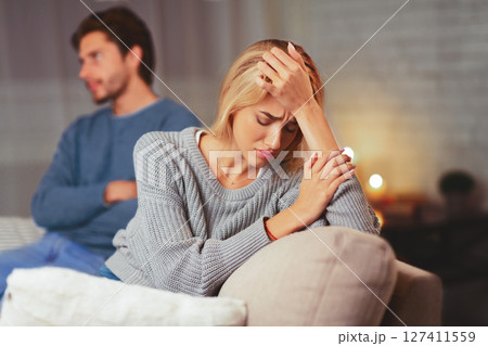 Break Up. Frustrated Woman Sitting Next To Indifferent Man On Couch After Quarrel At Home. Selective Focus Break Up. Frustrated Woman Sitting Next To Indifferent Man On Couch After Quarrel At Home. Selective Focus 127411559