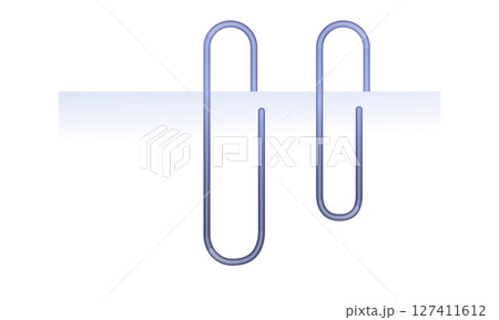 A semi-realistic illustration of a paperclip attached to a piece of paper on both sides. The design captures the detailed texture of the paper and the metallic shine of the paperclip. This vector 127411612