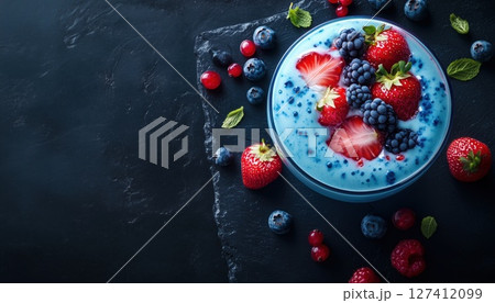 Delicious Summer Strawberry Berry Colada Cocktail With Fresh Berries And Blue Liqueur On A Stylish Delicious Summer Strawberry Berry Colada Cocktail With Fresh Berries And Blue Liqueur On A Stylish 127412099