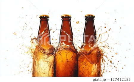 Three Brown Beer Bottles Cheers With Beer Pouring And Spilling On A White Background 127412183