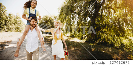 After-Quarantine Day. Family Of Three Walking In Nature Spending Time Together Going On Summer Picnic In Countryside 127412672
