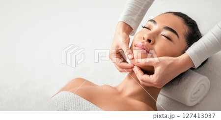 Face Lifting Massage. Young Korean Woman Getting Beauty Treatments By Professional Masseur At Cosmetology Cabinet, Relaxed Asian Female Enjoying Wellness Day At Spa Salon, Closeup Shot 127413037