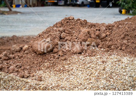 Excavation site action soil pile in construction zone outdoor close-up natural terrain 127413389