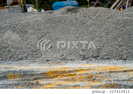 Urban excavation action construction landscape at ground level in industrial environment Urban excavation action construction landscape at ground level in industrial environment 127413411