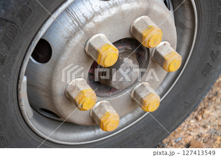 Truck wheel close-up workshop setting industrial equipment detailed focus mechanical concept 127413549