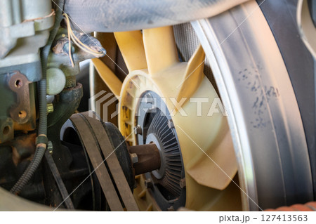Engine maintenance in industrial garage a close-up view of mechanical concepts Engine maintenance in industrial garage a close-up view of mechanical concepts 127413563