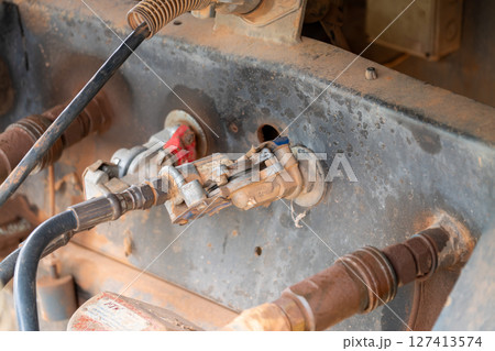 Industrial equipment maintenance workshop close-up mechanic's view hydraulic systems Industrial equipment maintenance workshop close-up mechanic's view hydraulic systems 127413574