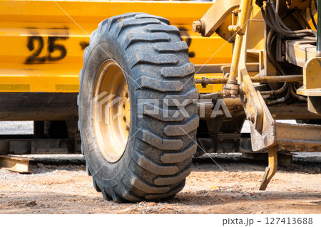 Construction equipment action urban site equipment close-up industrial environment side view heavy machinery 127413688