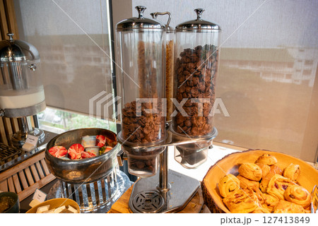 Delicious breakfast buffet display cozy atmosphere and gourmet experience at hotel restaurant 127413849
