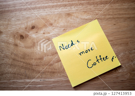 Morning coffee reminder note office desk sticky note casual environment close-up view motivation concept Morning coffee reminder note office desk sticky note casual environment close-up view motivation concept 127413953