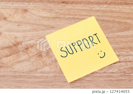 Supportive messages work environment visual content office desk close-up motivational concept 127414055