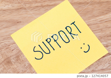Supportive notes encourage positivity at work office desk indoor close-up conceptual 127414057