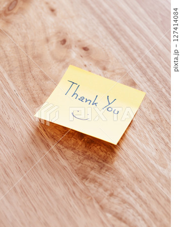 Thank you note wooden surface minimalist lifestyle simple message warm environment close-up view Thank you note wooden surface minimalist lifestyle simple message warm environment close-up view 127414084