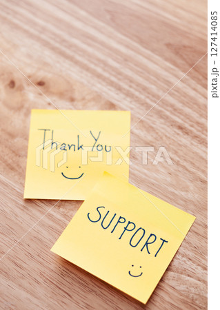Thank you support notes wooden table positive message cozy home environment close-up view 127414085