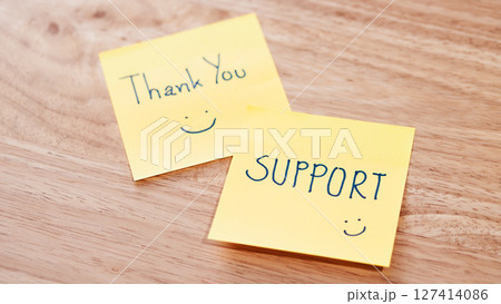 Appreciation notes expressing support office desk warm close-up gratitude concept 127414086