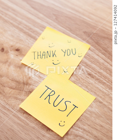 Trust and gratitude sticky notes office desk motivational content bright environment close-up view 127414092