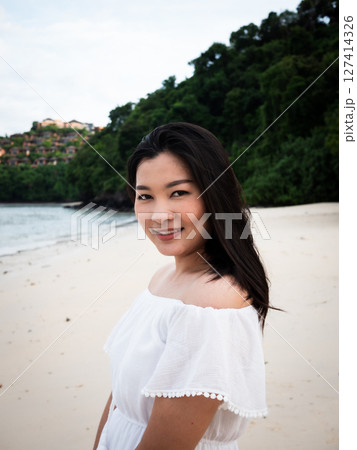Captivating travel moments a woman enjoys thailand's serene beach portrait coastal paradise natural beauty Captivating travel moments a woman enjoys thailand's serene beach portrait coastal paradise natural beauty 127414326