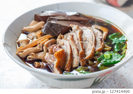 Delicious chinese noodle soup local market food cozy setting close-up shot culinary delight Delicious chinese noodle soup local market food cozy setting close-up shot culinary delight 127414400
