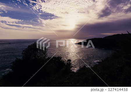 Sunset over tranquil ocean coastal vista landscape serene nature elevated viewpoint Sunset over tranquil ocean coastal vista landscape serene nature elevated viewpoint 127414438