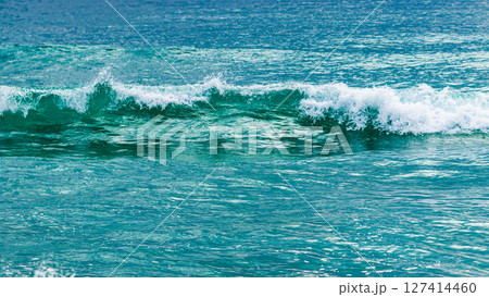 Waves crashing shore coastal beach nature serene environment close-up view ocean beauty Waves crashing shore coastal beach nature serene environment close-up view ocean beauty 127414460