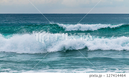 Waves crashing the shore ocean beach nature calm environment captured viewpoint 127414464