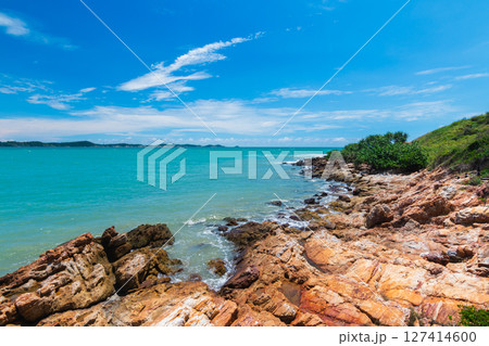 Seaside serenity coastal rock formation tropical beach nature scenic view tranquil vibes 127414600