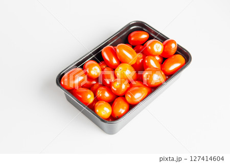 Harvesting fresh cherry tomatoes kitchen table food bright lighting top-down culinary delights Harvesting fresh cherry tomatoes kitchen table food bright lighting top-down culinary delights 127414604
