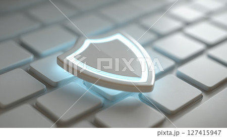 Shield Icon Representing Cybersecurity on a White Keyboard Surface 127415947