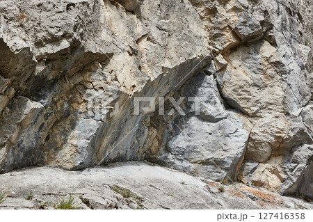 Mountain rock formation jagged cliffs boulder details 127416358