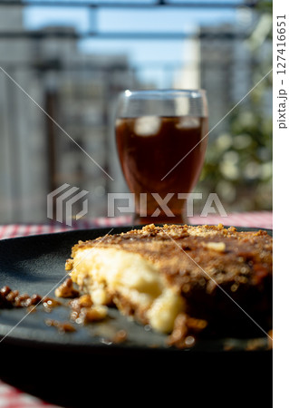 A slice of homemade shephard's pie served on a plate on a table. Vertical orientation. A slice of homemade shephard's pie served on a plate on a table. Vertical orientation. 127416651
