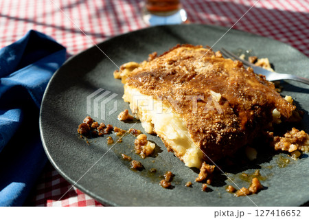 A slice of homemade shephard's pie served on a plate on a rustic table A slice of homemade shephard's pie served on a plate on a rustic table 127416652