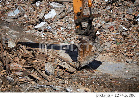 excavator bucket on dismantling site, side view 127416800