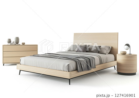 A bed with a white comforter and pillows is shown with a lamp and a nightstand 127416901