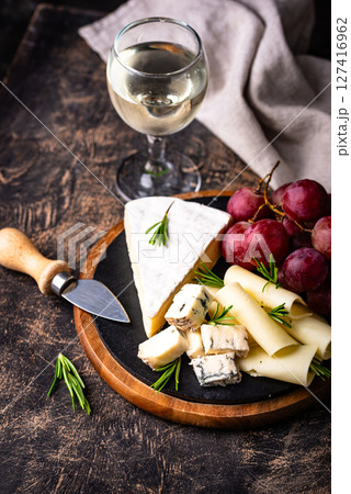 Different types of cheese, wine and grapes Different types of cheese, wine and grapes 127416962